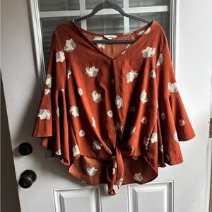 Orange floral blouse